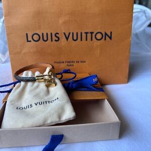 LV Bracelet, new, 6.7. Inches length 
2” 5/8 diameter. dust bag, box and bag